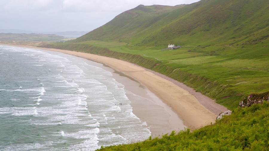 Rhossili Beach showing a sandy beach, landscape views and a bay or harbor
