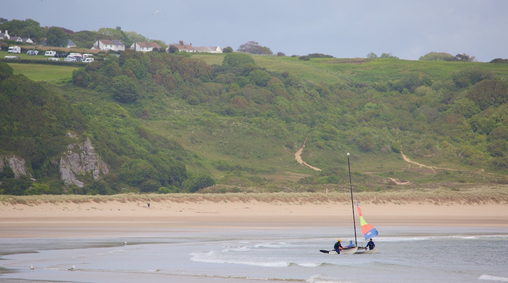 Oxwich Bay Beach featuring a bay or harbour and a beach