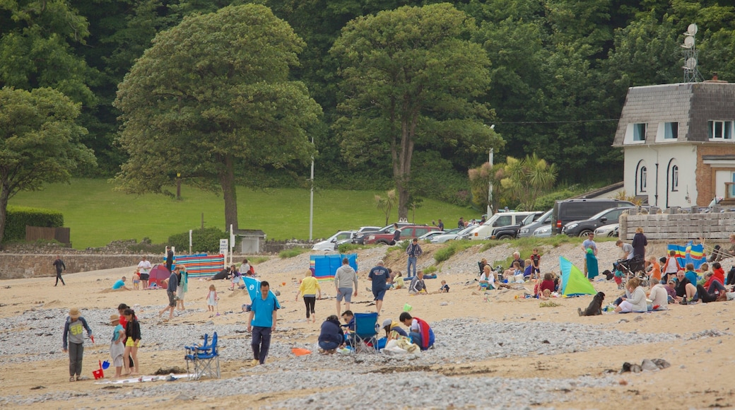 Oxwich Bay Beach showing a sandy beach as well as a large group of people