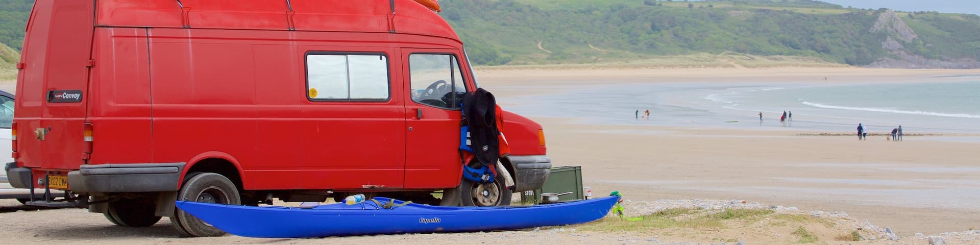 Oxwich Bay Beach showing vehicle touring and a beach