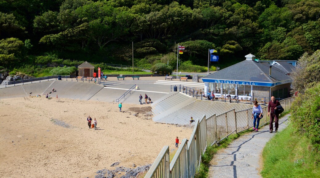 Praia de Caswell Bay mostrando escalada ou caminhada e uma praia