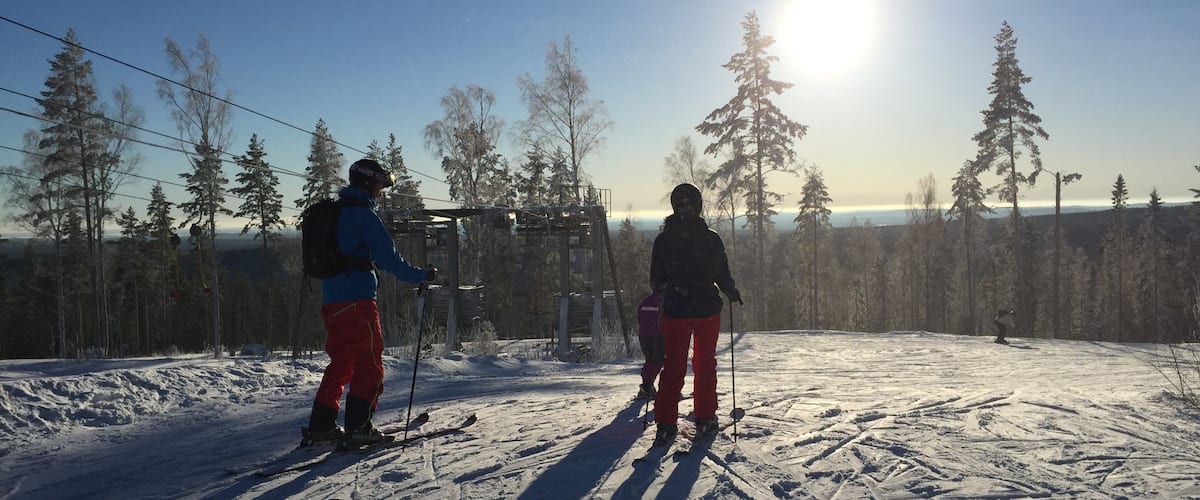Kungsberget Ski Resort featuring snow skiing and snow as well as a small group of people