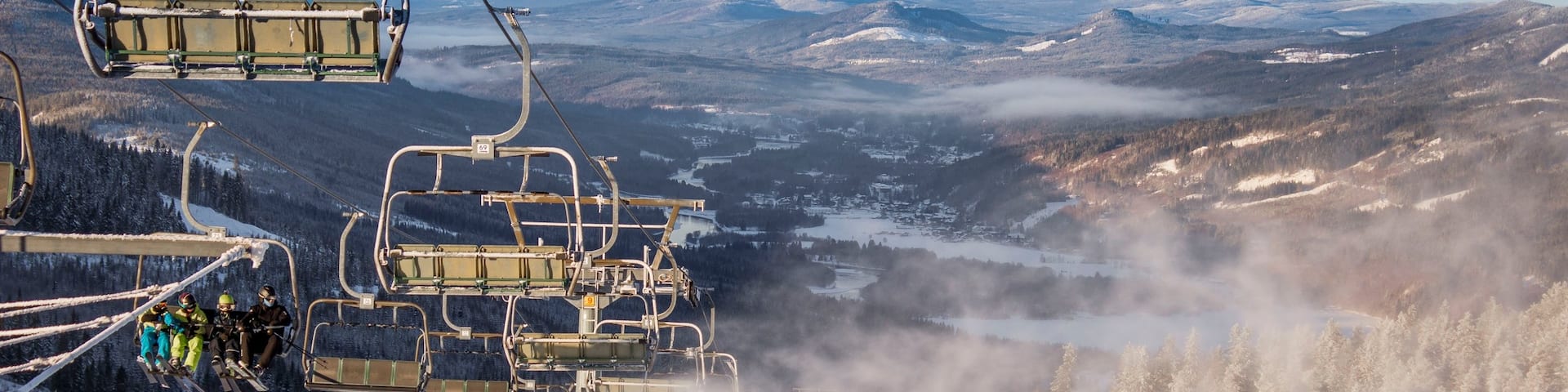 Branas Ski Resort featuring a gondola, mist or fog and snow