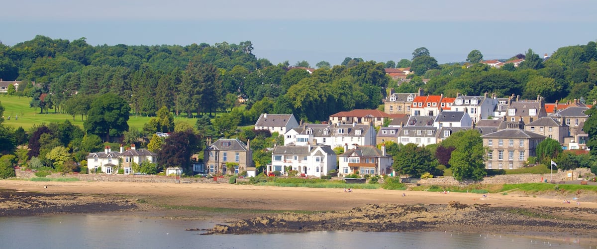 Aberdour featuring a coastal town, a beach and rugged coastline