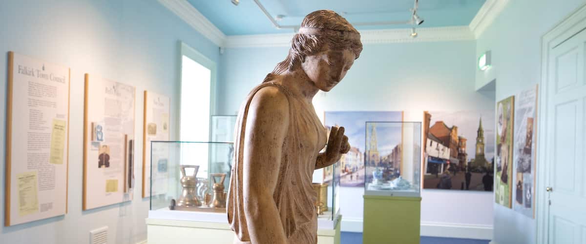 Callendar House which includes a statue or sculpture and interior views