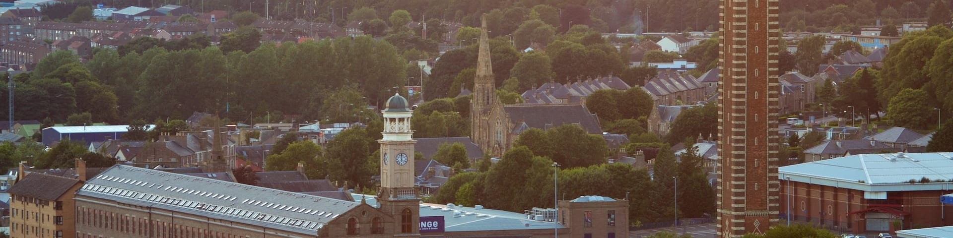 Dundee Law which includes a sunset and a small town or village