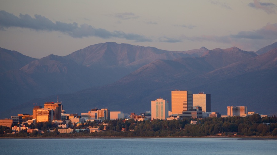 Point Woronzof Park which includes a city, a sunset and general coastal views