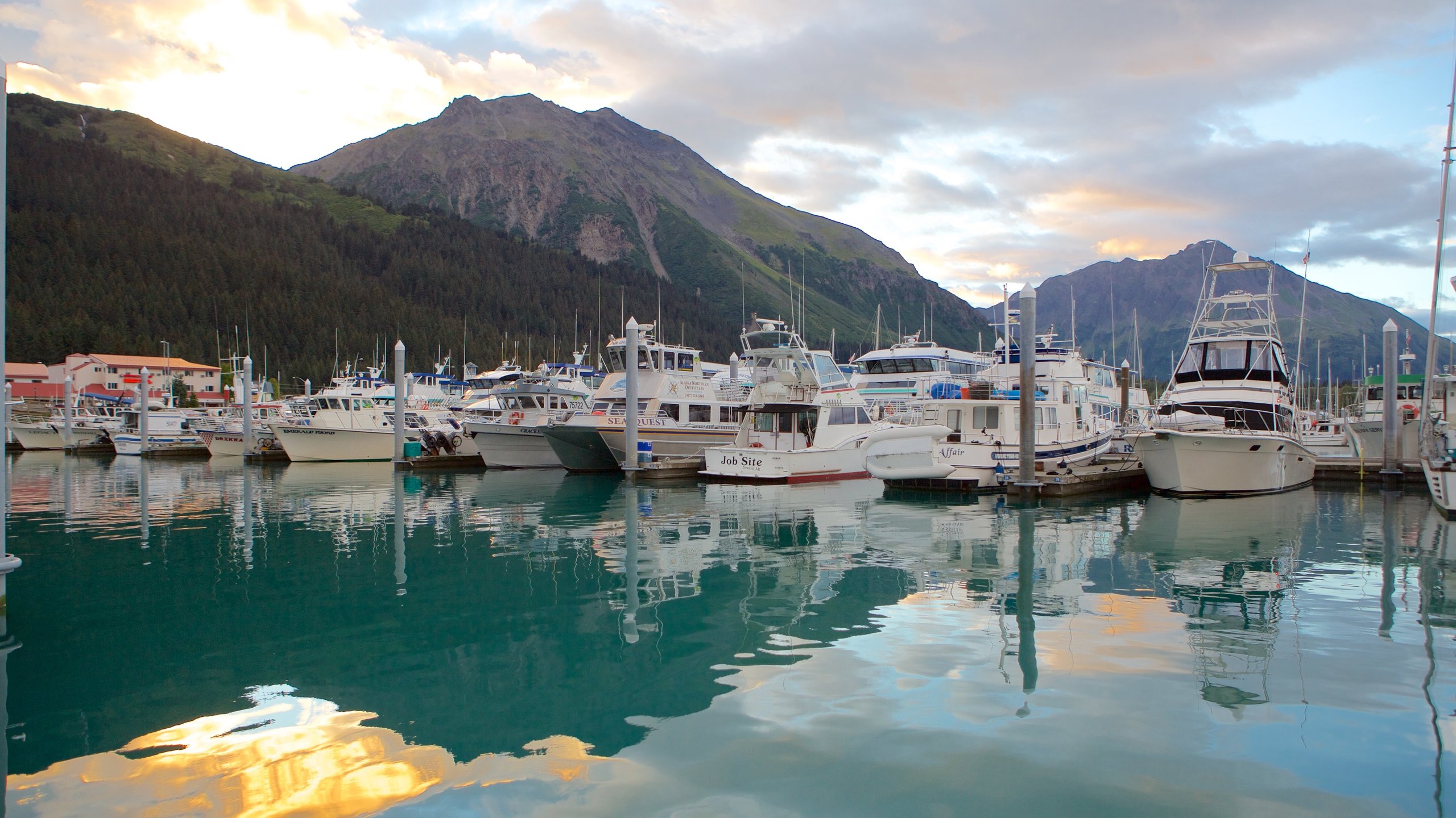 Seward featuring a marina, mountains and a sunset