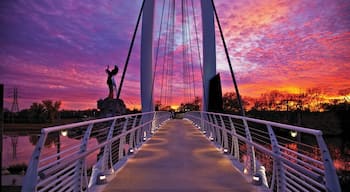 Wichita showing a sunset and a bridge