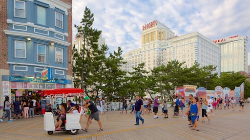 Atlantic City Boardwalk featuring a city and street scenes as well as a large group of people