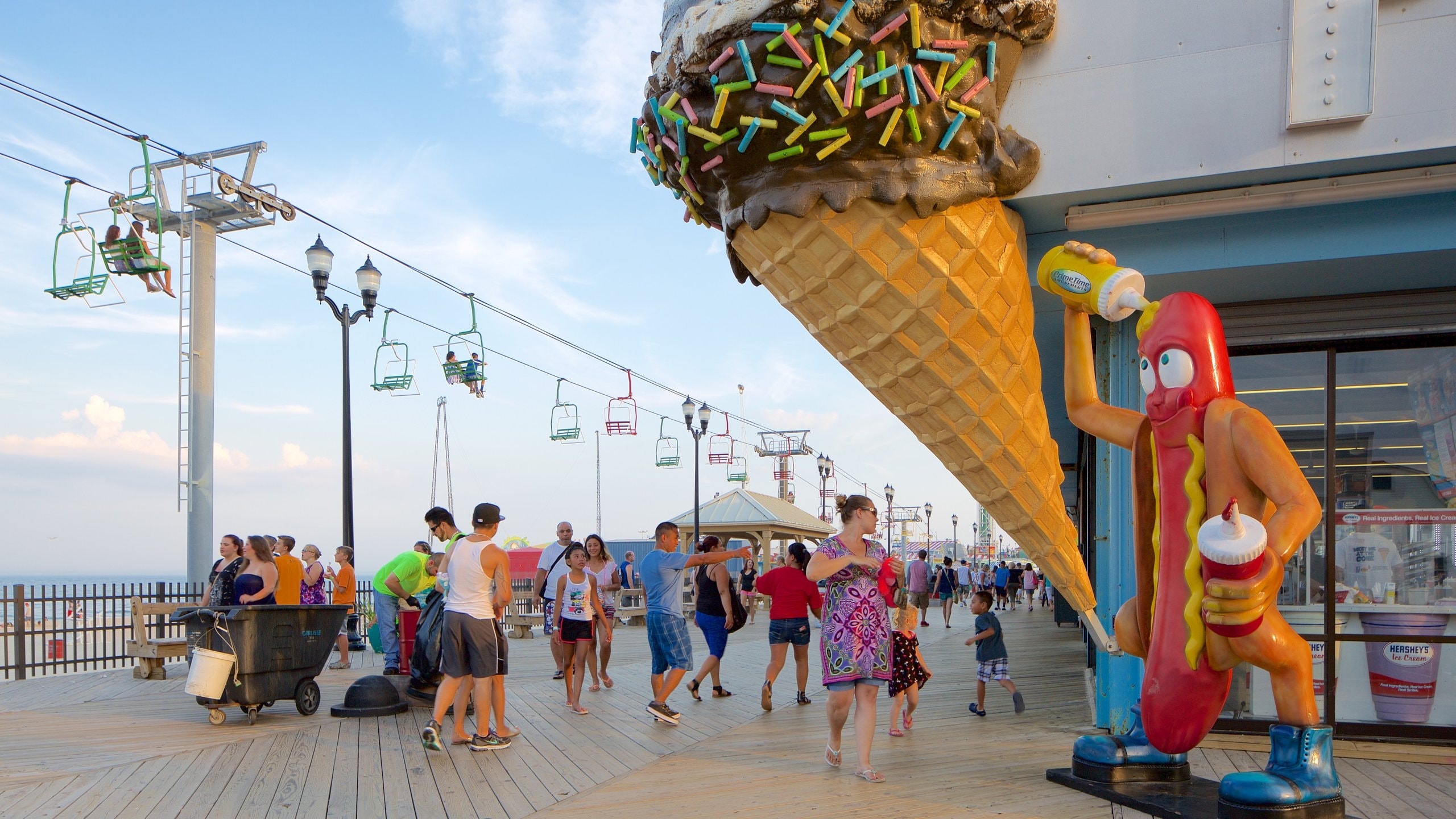Seaside Heights featuring a gondola as well as a large group of people
