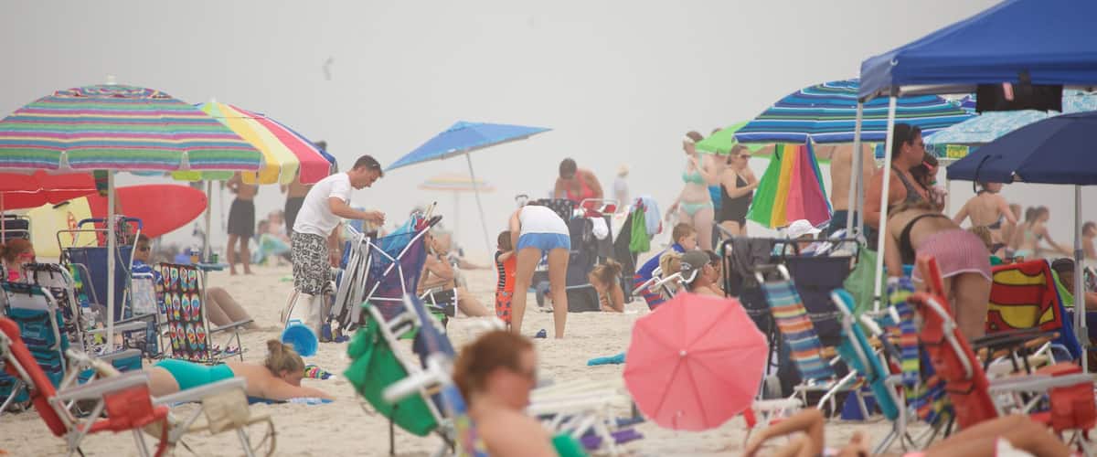 Atlantic City showing a sandy beach and general coastal views as well as a large group of people