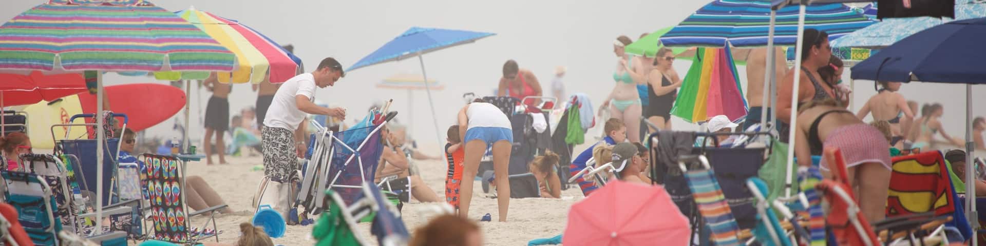 Atlantic City showing a sandy beach and general coastal views as well as a large group of people