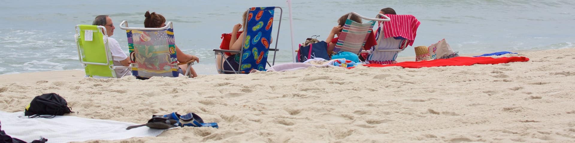 Jersey Shore showing a sandy beach as well as a large group of people