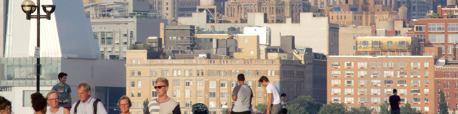Hoboken Waterfront featuring a city as well as a small group of people