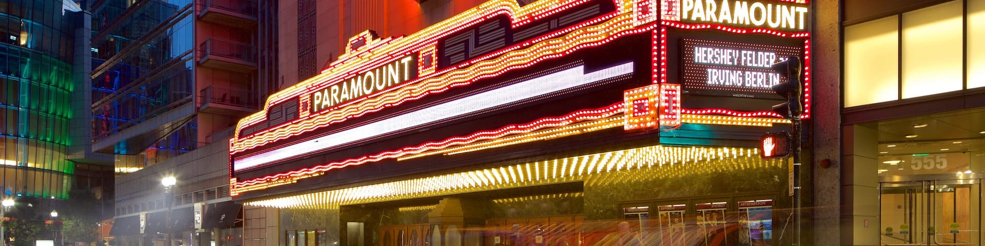Theatre District which includes night scenes and signage