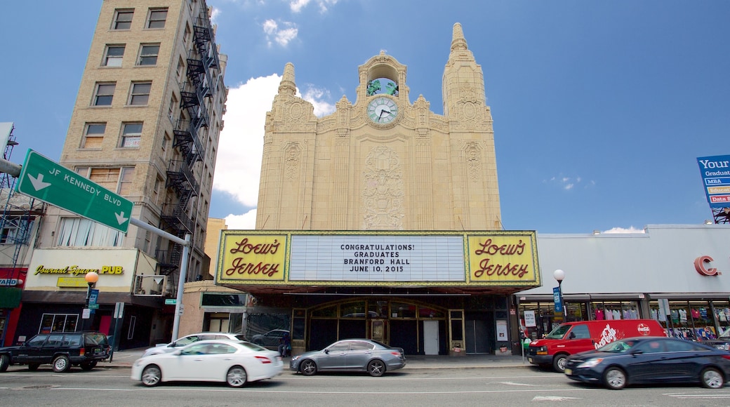 Loew\'s Jersey Theater showing theater scenes, a city and signage