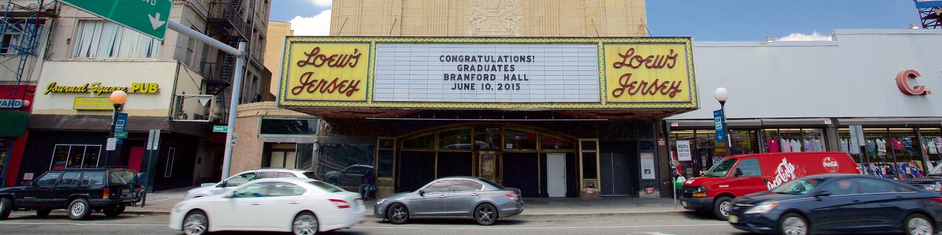 Loew\'s Jersey Theater which includes signage, a city and theatre scenes