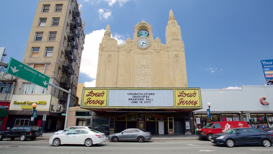 Loew\'s Jersey Theater showing theater scenes, a city and signage