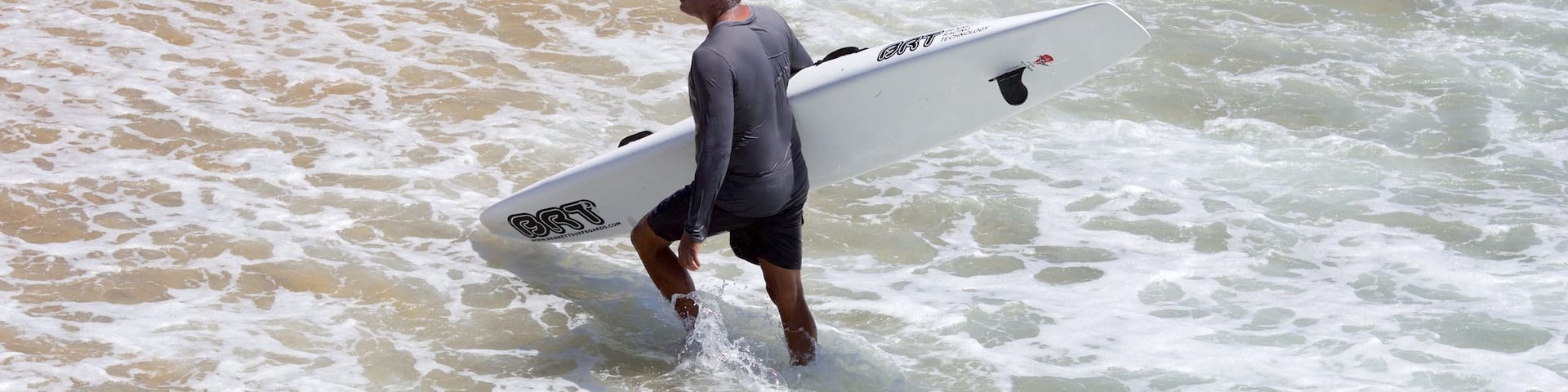 Hermosa Beach which includes surfing as well as an individual male
