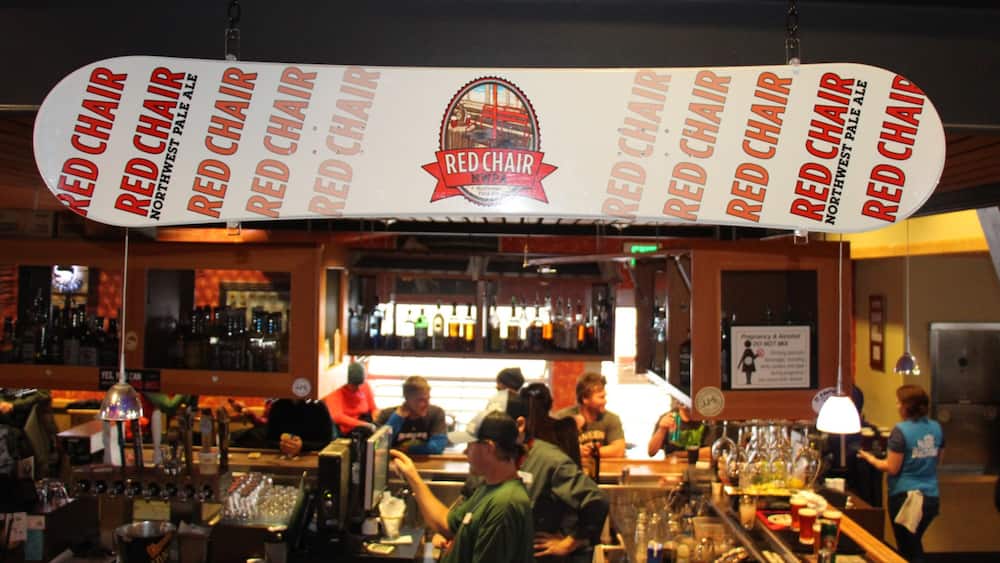 Mt. Bachelor Ski Resort featuring signage, a bar and interior views
