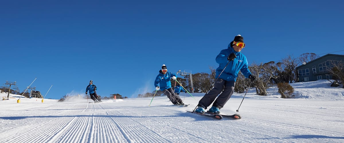 Perisher Ski Resort showing snow and snow skiing as well as a small group of people