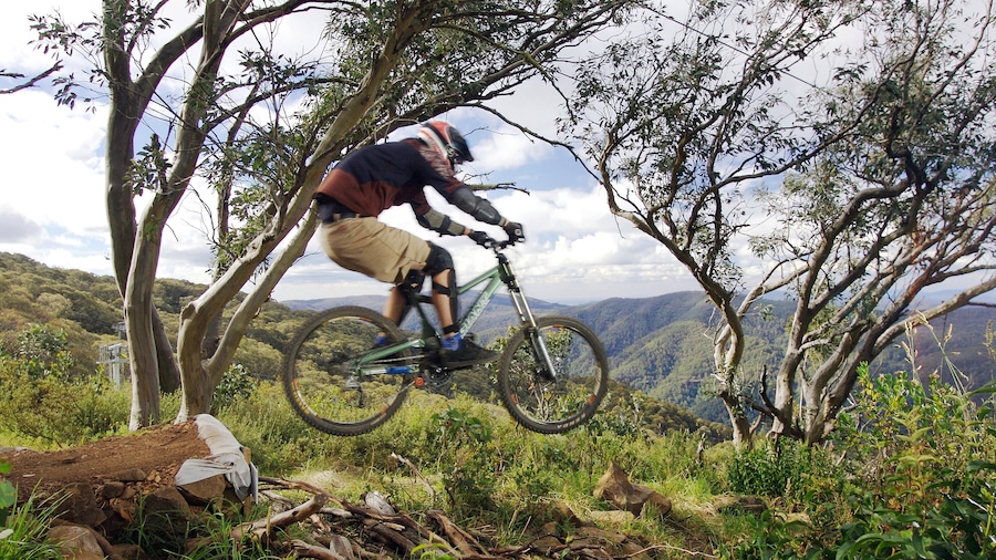 Mt. Buller Ski Slopes showing mountains and mountain biking as well as an individual male