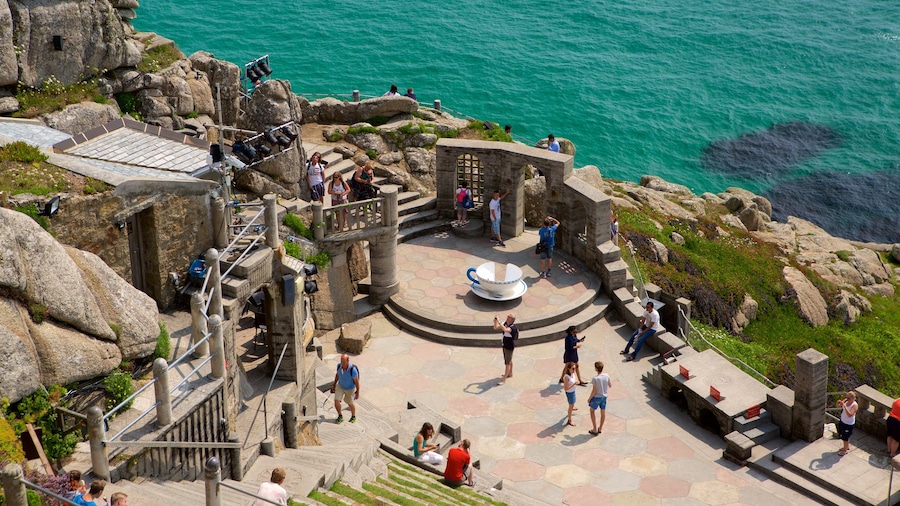 Minack Theatre showing general coastal views and views as well as a large group of people