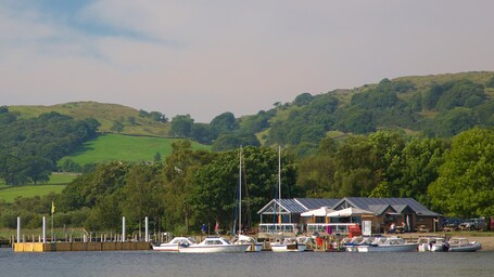 Coniston Water showing a small town or village, boating and a lake or waterhole