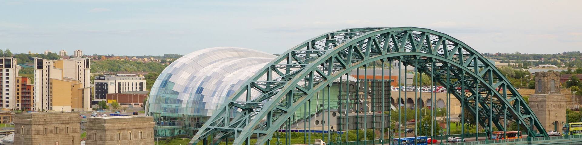 Tyne Bridge which includes a bridge, a river or creek and a city