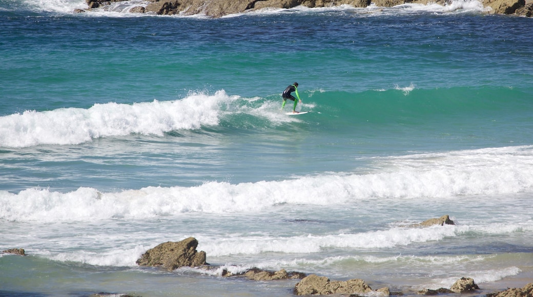 Fistral Beach featuring waves, a beach and surfing