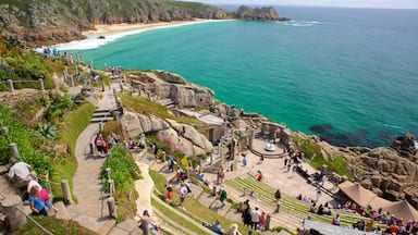 Minack Theatre which includes general coastal views, a coastal town and rocky coastline