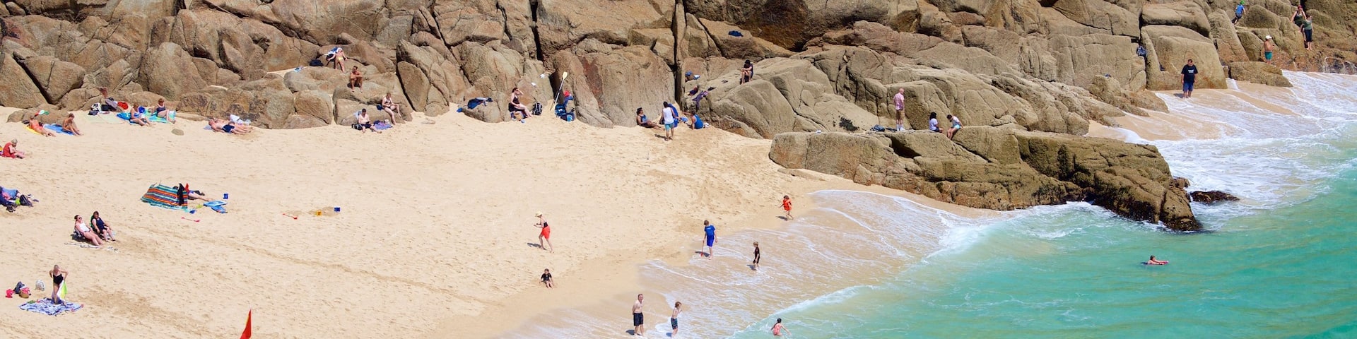 Porthcurno Beach featuring swimming, general coastal views and a sandy beach