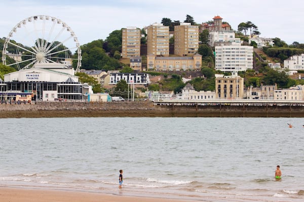 Abbey Sands which includes a coastal town, swimming and a sandy beach
