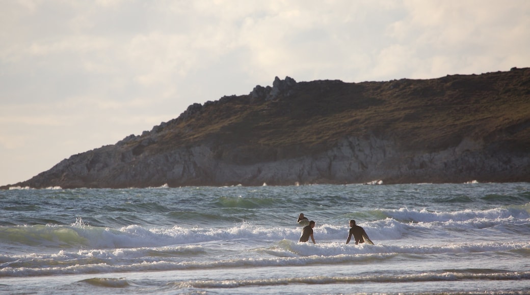 Woolacombe showing rugged coastline, swimming and surf