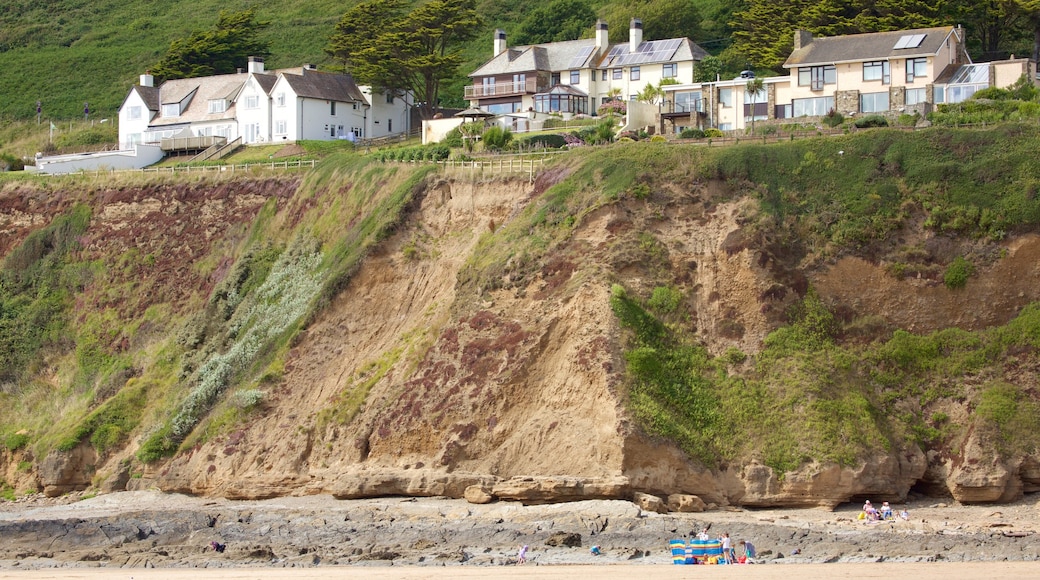 Saunton showing a coastal town and rugged coastline