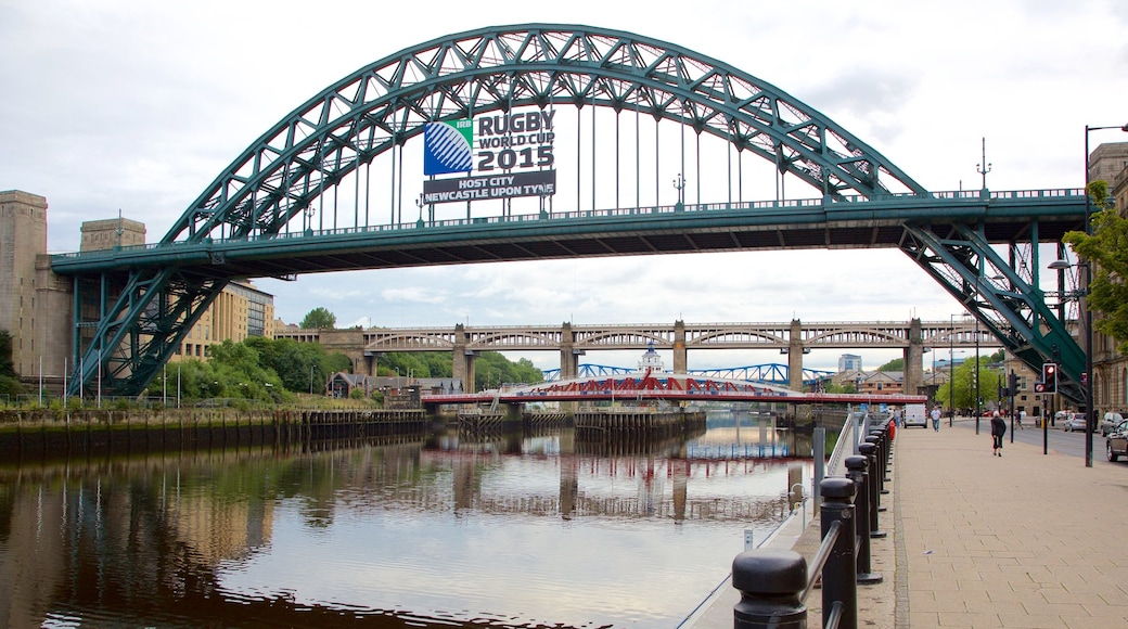 Tyne Bridge featuring a bridge, signage and a river or creek