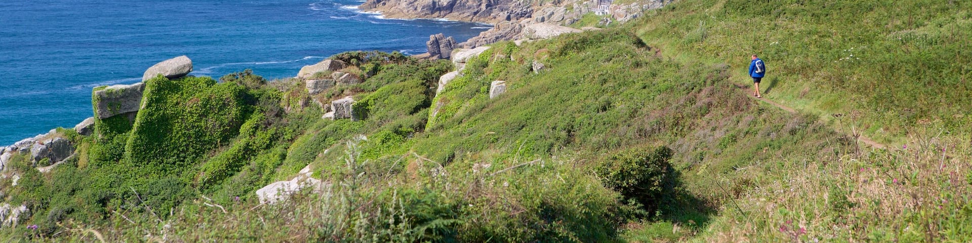 Porthcurno Beach showing landscape views, tranquil scenes and rugged coastline