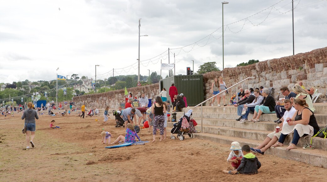 Abbey Sands featuring a beach as well as a large group of people