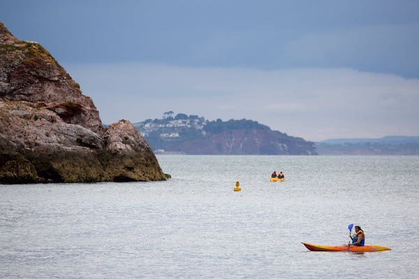 Babbacombe Beach which includes kayaking or canoeing and general coastal views