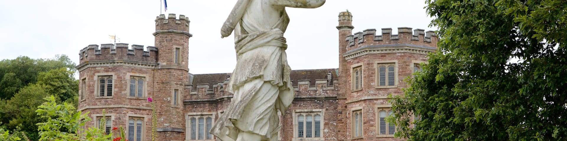 Mt. Edgcumbe featuring a statue or sculpture, a castle and a garden