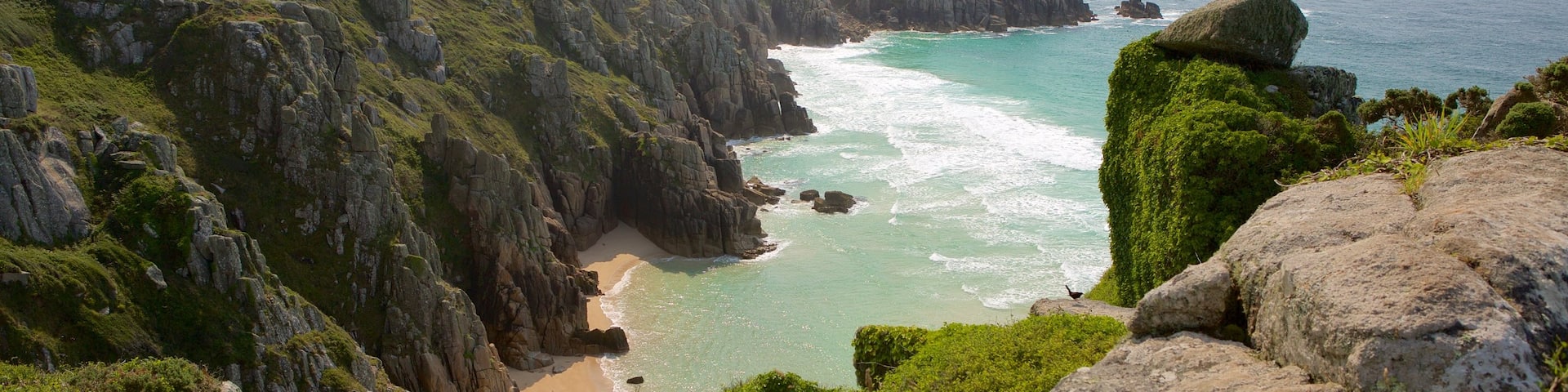 Logan\'s Rock which includes a sandy beach and landscape views