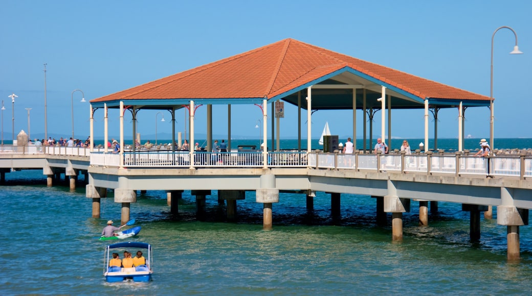 Redcliffe showing general coastal views as well as a small group of people