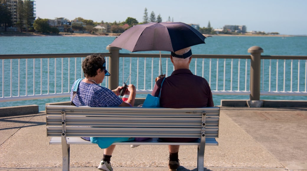 Redcliffe showing general coastal views as well as a small group of people