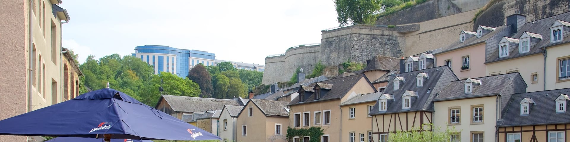 Luxembourg showing outdoor eating, heritage architecture and a river or creek