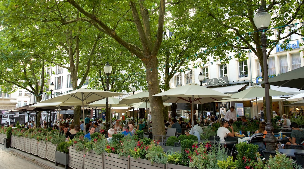 Place d\'Armes showing café scenes and outdoor eating as well as a large group of people