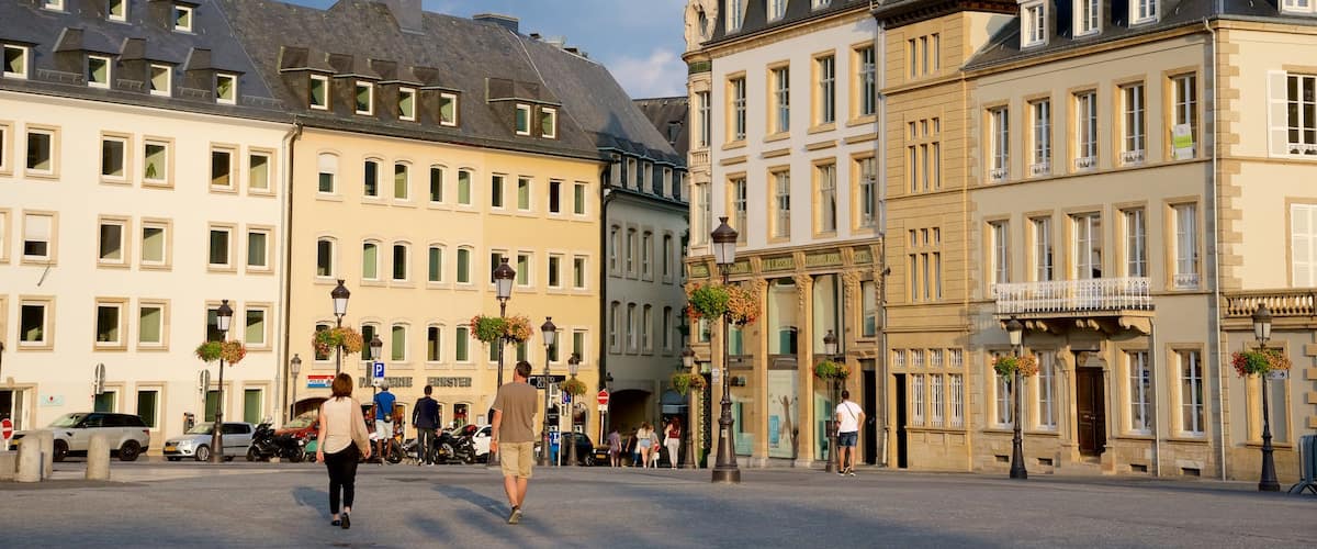 Luxembourg showing heritage architecture and a square or plaza as well as a small group of people
