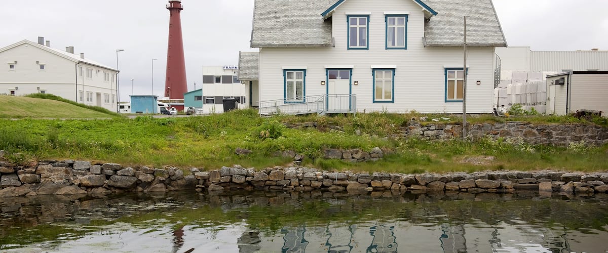 Andenes which includes a lighthouse and a house