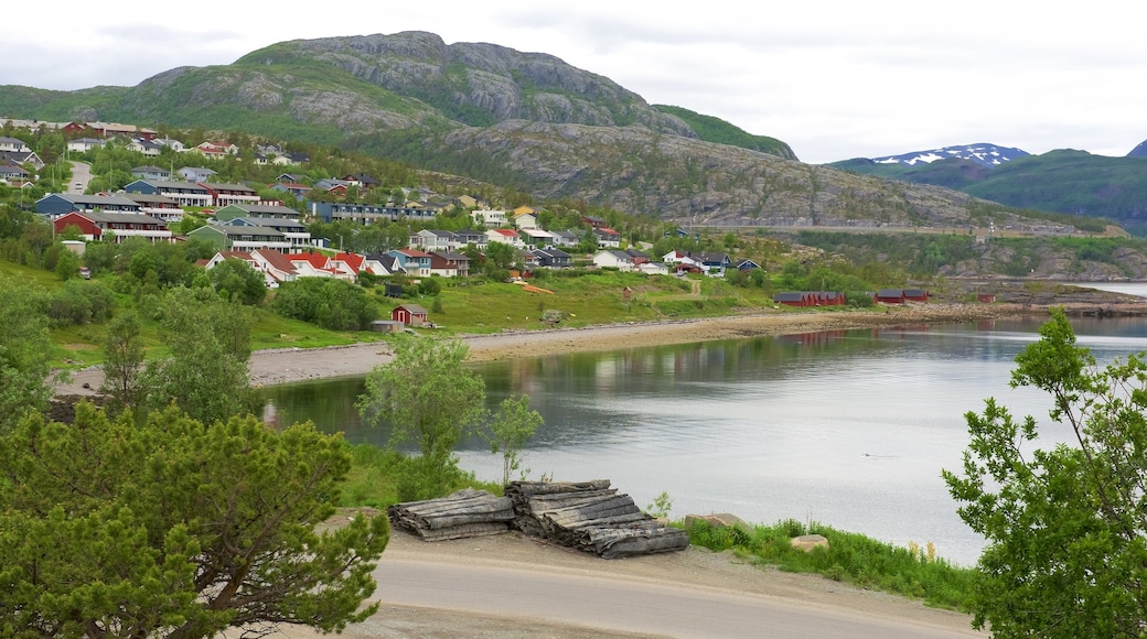 Alta showing mountains, a lake or waterhole and a small town or village