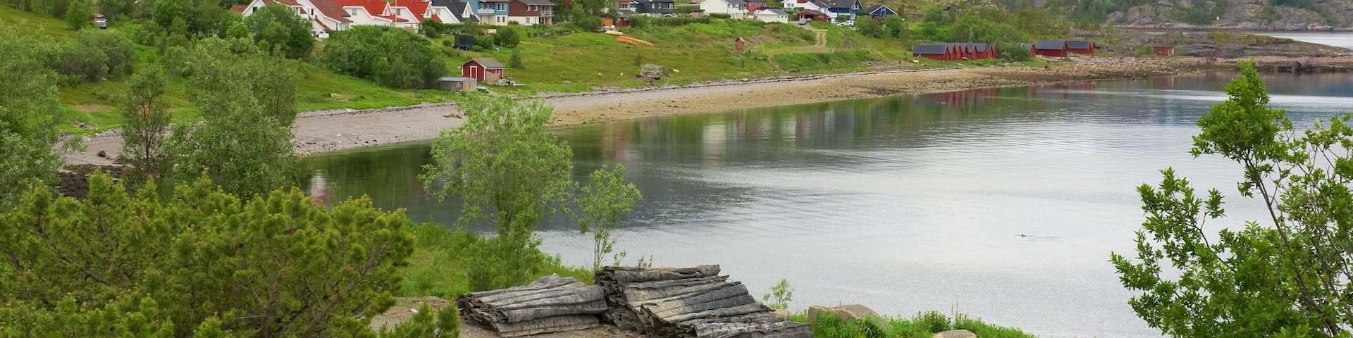 Alta featuring a lake or waterhole, mountains and a small town or village